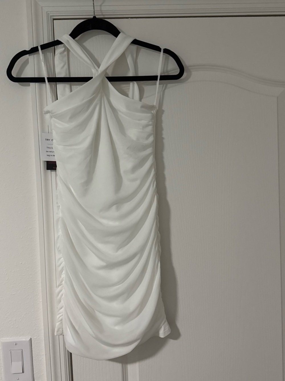 Elegant White Ruched Mini Dress with Cross-Back Detail